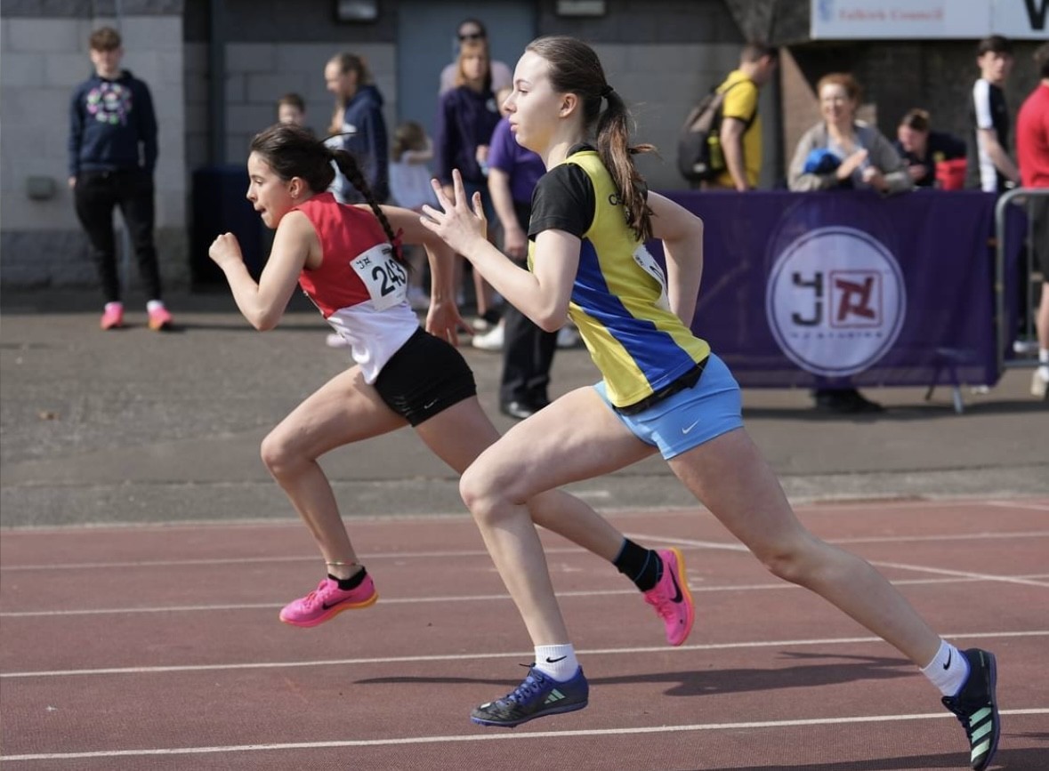 Branna Kenny (left) took gold in the girls 70m hurdles in Grangemouth. Image: Simon Wootton