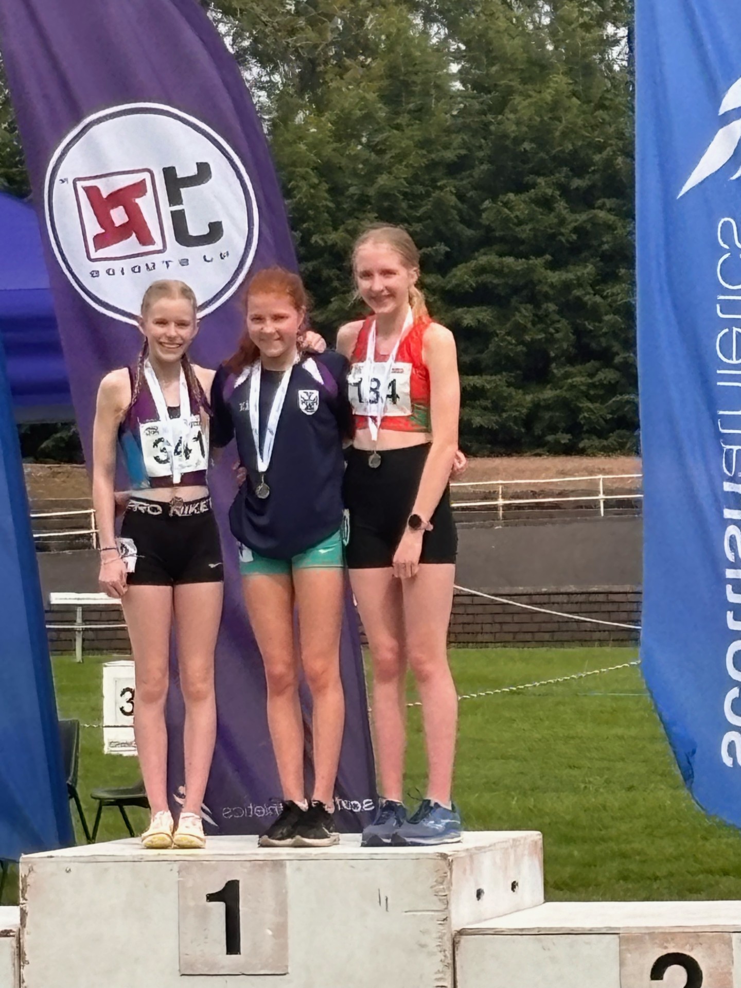 Freya Brown (centre) timed her sprint perfectly to clinch gold in the 1,500m