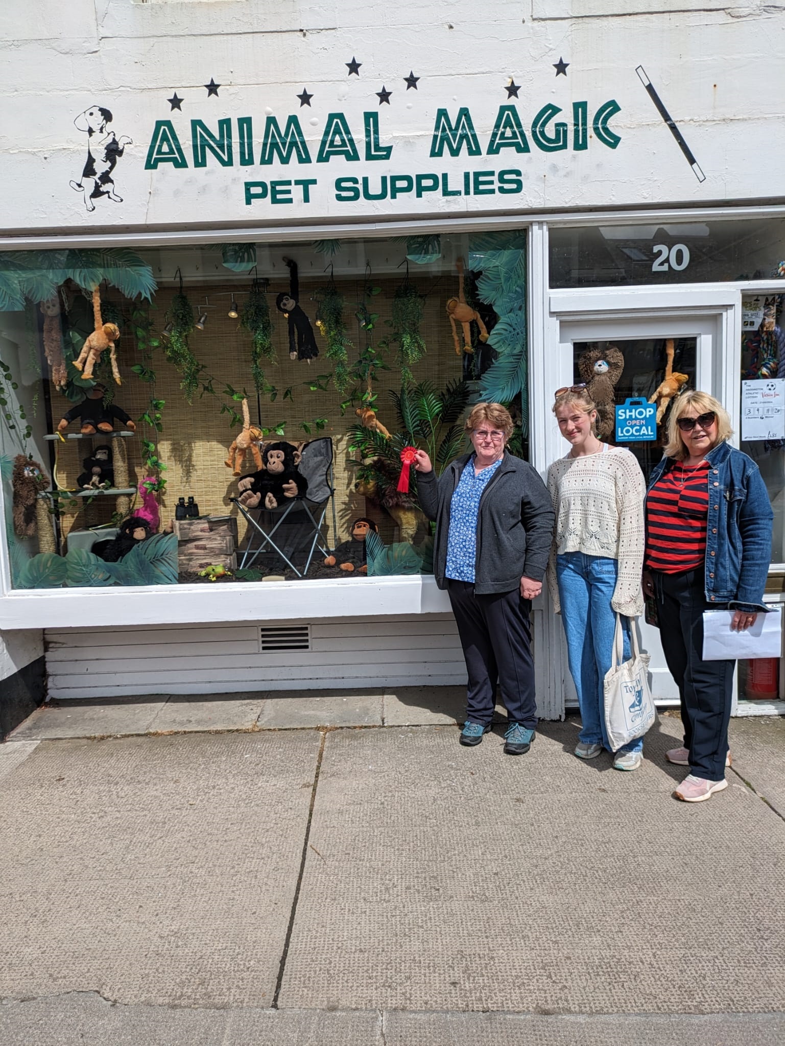 Natalie Campbell, from Knox Academy, and Christine Read, from Haddington and District Community Council, alongside Margaret Johnston, of Animal Magic, which came joint first in the window competition